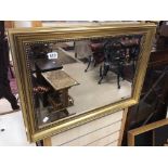 VINTAGE BEVELLED EDGED MIRROR IN A GILDED FRAME 77 X 55CM