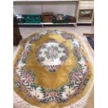 A VINTAGE OVAL RUG, 280 X 186CM