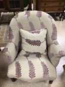 A VICTORIAN ARMCHAIR (RECENTLY REUPHOLSTERED)