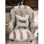 A VICTORIAN ARMCHAIR (RECENTLY REUPHOLSTERED)