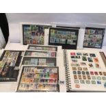 A QUANTITY OF STAMPS INCLUDES AN ALBUM