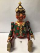 A VINTAGE WOODEN PINOCCHIO FIGURE WITH REMOVABLE ARMS AND LEGS