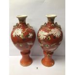 A PAIR OF LARGE EARLY 20TH CENTURY SATSUMA VASES PAINTED CHRYSANTHEMUMS ON IRON RED GROUND, 41CM