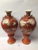 A PAIR OF LARGE EARLY 20TH CENTURY SATSUMA VASES PAINTED CHRYSANTHEMUMS ON IRON RED GROUND, 41CM