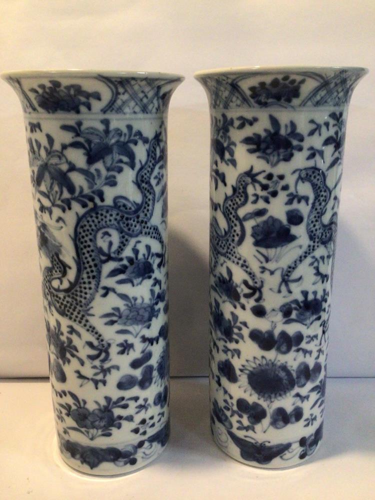 A PAIR OF CHINESE KANGXI BLUE AND WHITE SPILL VASES WITH SCROLLING DRAGONS AMIDST FLOWERING BLOOMS - Image 2 of 6