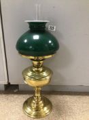 A VICTORIAN BRASS OIL LAMP WITH GREEN GLASS SHADE