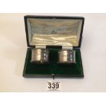 CASED SET OF HALLMARKED SILVER NAPKIN RINGS BY MAPPIN AND WEBB