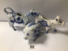 TWO VINTAGE DELPH CREAMER JUGS (COWS) WITH A MONEY BOX PIG