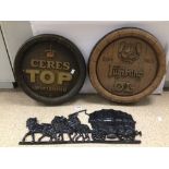 TWO PLASTIC BEER KEGTOPS, WITH A CAST IRON WALL, MOUNTED HORSE AND CARRIAGE