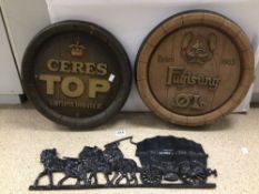 TWO PLASTIC BEER KEGTOPS, WITH A CAST IRON WALL, MOUNTED HORSE AND CARRIAGE