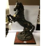 LARGE BRONZED RESIN REARING STALLION ON WOODEN BASE. BEING 60CM IN HEIGHT.