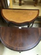 TWO REPRODUCTION HALF MOON HALL TABLES ONE WITH BROWN LEATHER TOP AND FLUTED LEGS, THE LARGEST, 84 X