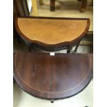 TWO REPRODUCTION HALF MOON HALL TABLES ONE WITH BROWN LEATHER TOP AND FLUTED LEGS, THE LARGEST, 84 X