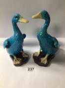 TWO CHINESE PORCELAIN TURQUOISE BLUE FIGURAL DUCKS. THE LARGEST BEING 23CM IN HEIGHT.