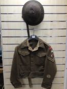CHESHIRE REGIMENT MILITARY 1944 ARMY BATTLEDRESS JACKET WITH A MILITARY HELMET