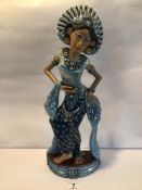 A LARGE PAINTED WOODEN FIGURINE OF A THAI WOMAN. BEING 48CM IN HEIGHT