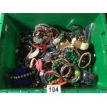 BOX OF MIXED COSTUME JEWELLERY, INCLUDES BANGLES, BRACELETS, NECKLACES, AND MORE