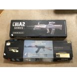 TWO USED AIRSOFT 6MM BB GUNS. CYMA CM.022 AEG AND NEW EDITION L85A2 SERIES. BOTH BOXED AND ONE