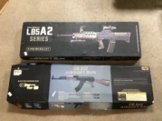 TWO USED AIRSOFT 6MM BB GUNS. CYMA CM.022 AEG AND NEW EDITION L85A2 SERIES. BOTH BOXED AND ONE