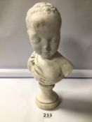 A CHALK WARE BUST OF A YOUNG CHILD. BEING 33CM IN HEIGHT.