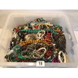 LARGE COLLECTION OF COSTUME JEWELLERY. INCLUDES BANGLES, NECKLACES, BRACELETS, AND MORE