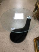 A MODERN BLACK PLASTIC AND GLASS SIDE TABLE, 54CM