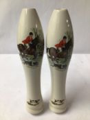 TWO WHITE PORCELAIN BEER PUMP PULL HANDLES, WITH HUNTING SCENE DESIGN.