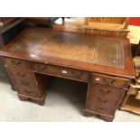 VINTAGE WOODEN KNEE HOLE WRITING DESK WITH BROWN LEATHER TOP AND NINE DRAWERS