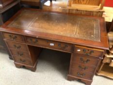 VINTAGE WOODEN KNEE HOLE WRITING DESK WITH BROWN LEATHER TOP AND NINE DRAWERS