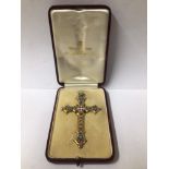 CASED YELLOW METAL AND ENAMEL CRUCIFIX, 8CM