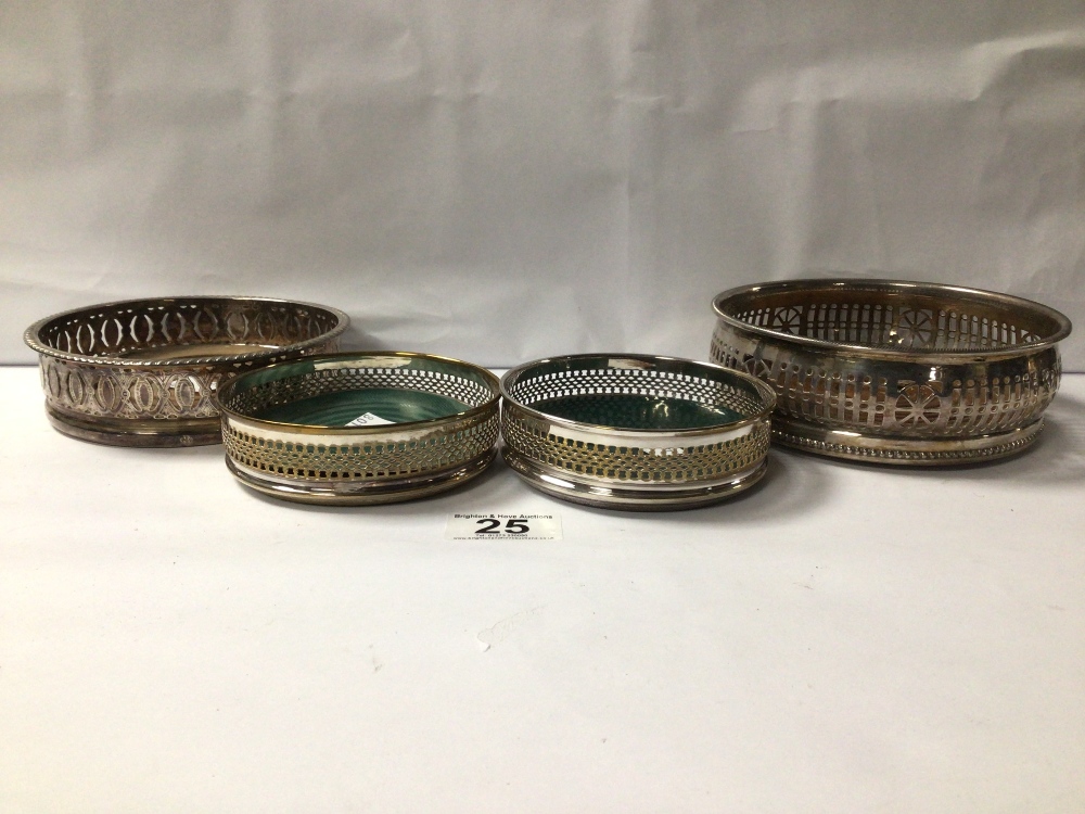 FOUR SILVER-PLATED WINE BOTTLE COASTERS. PAIR ENGRAVED R&D, ENGLAND, AND ONE ENGRAVED WITH A FLEUR