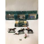 FOUR DIE CAST CORGI VEHICLES WITH FOUR PAINTED LEAD SOLDIERS INCLUDING THREE ON HORSEBACK.