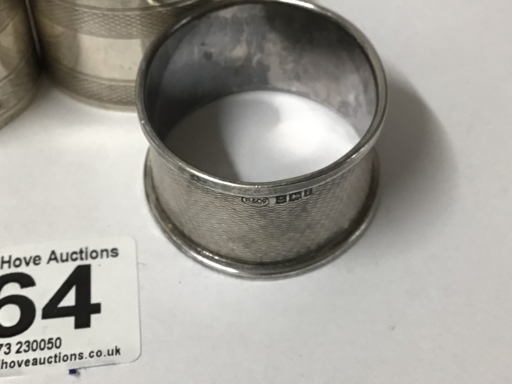 FOUR HALLMARKED SILVER ENGINE TURNED NAPKIN RINGS, 88 GRAMS - Image 2 of 3