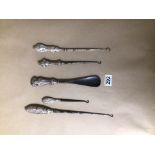 HALLMARKED SILVER HANDLE BUTTON HOOKS X 4 WITH A HALLMARKED SILVER HANDLE SHOE HORN