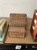 THREE NESTED CARVED WOOD TREES OF LIFE DOMED STORAGE CHESTS. LARGEST 23CM X 16CM X 16CM.