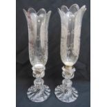 A pair of etched glass storm lanterns on raised fluted circular bases, 42cm (h)