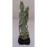 An oriental 19th century jadeite figurine of a lady on raised wooden base, 37cm (h)