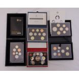 Four cased sets of proof GB coins