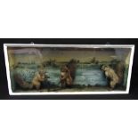 A Victorian taxidermy diorama of squirrels playing cricket against a painted background, 37 x 92 x