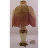 A glass baluster form vase decorated with gilding converted to a table lamp, mounted on a gilded