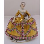 Sevres style figurine of a lady in a gilded crinoline dress with applied roses holding a dog with