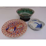 A quantity of oriental porcelain to include two dishes and a charger, A/F