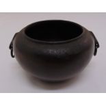 A Chinese bronze incense burner with ring side handles, marks to the base, 9cm (h) 17cm diameter