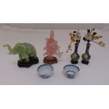 A quantity of oriental collectables to include two blue and white tea bowls with labels from The