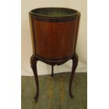 An Edwardian mahogany and satinwood wine cooler of cylindrical form with detachable copper liner, on