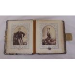 A Victorian leather bound photograph album to include period portrait photographs