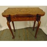 A Victorian mahogany and inlaid satinwood games table with hinged top on four cabriole legs, 77 x