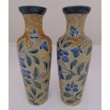 A pair of Doulton Lambeth 1881 vases decorated with flowers and leaves, marks to the bases, 27cm (