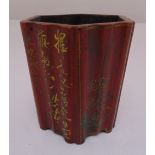 A Chinese Republic period lacquered wooden brush pot of fluted hexagonal form, decorated with