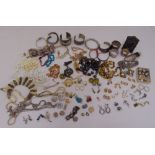 A quantity of silver, white metal and costume jewellery, a miniature silver photograph frame and two